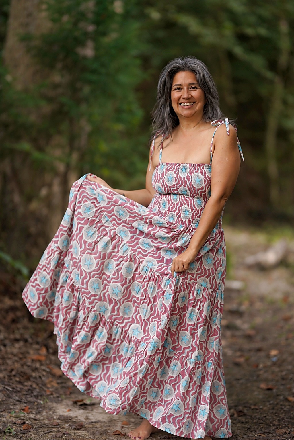 Princella Stringer smiling outdoors, founder of The Woopreneur Collective